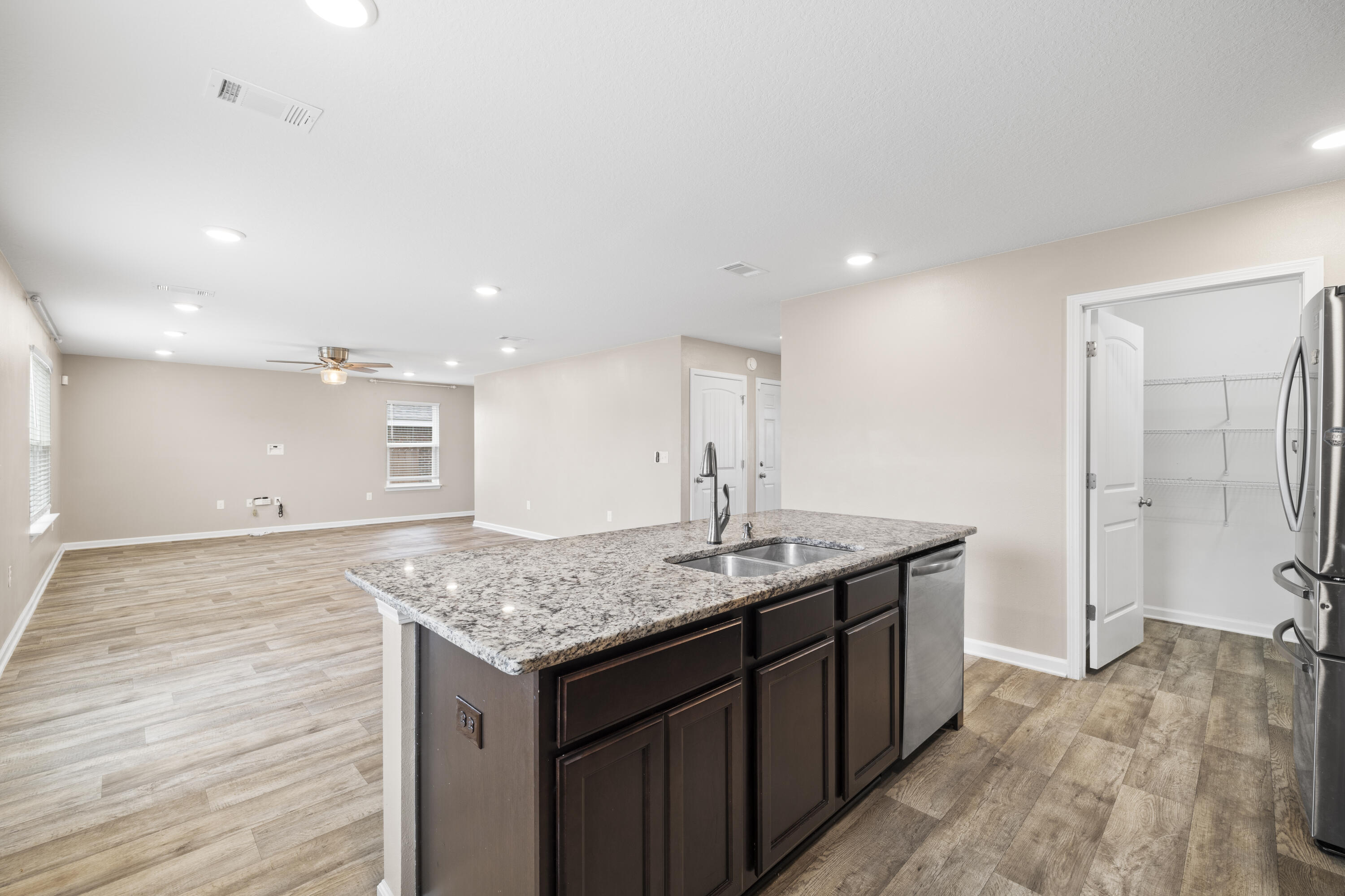 814 Moorhen Way Crestview, FL 32539 - Photo 21 of 29 a kitchen with a sink and a refrigerator
