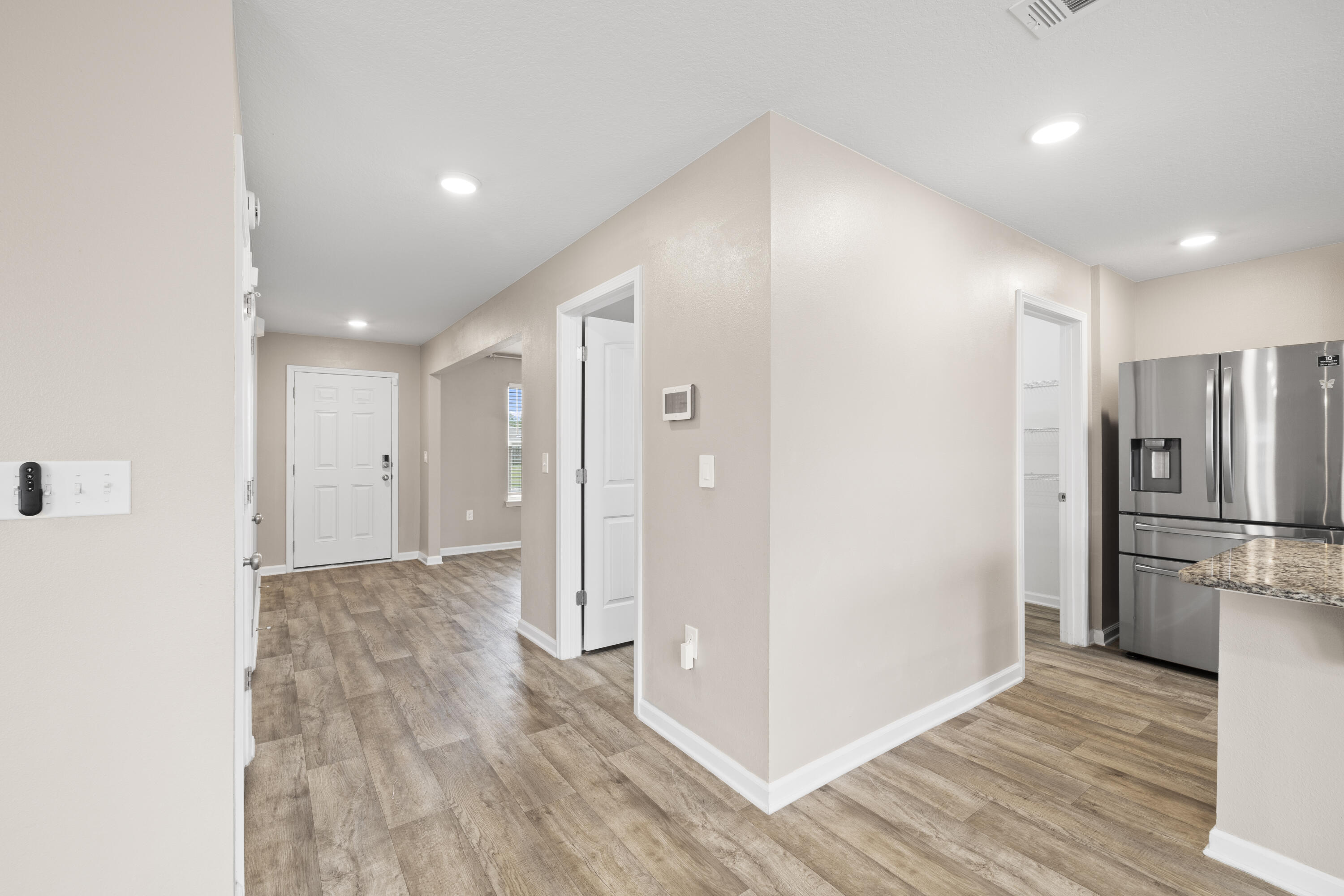 814 Moorhen Way Crestview, FL 32539 - Photo 23 of 29 a view of a kitchen with a refrigerator and a stove top oven