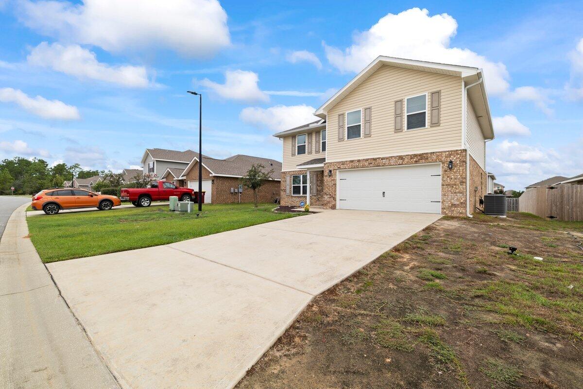814 Moorhen Way Crestview, FL 32539 - Photo 28 of 29 a front view of a house with a yard