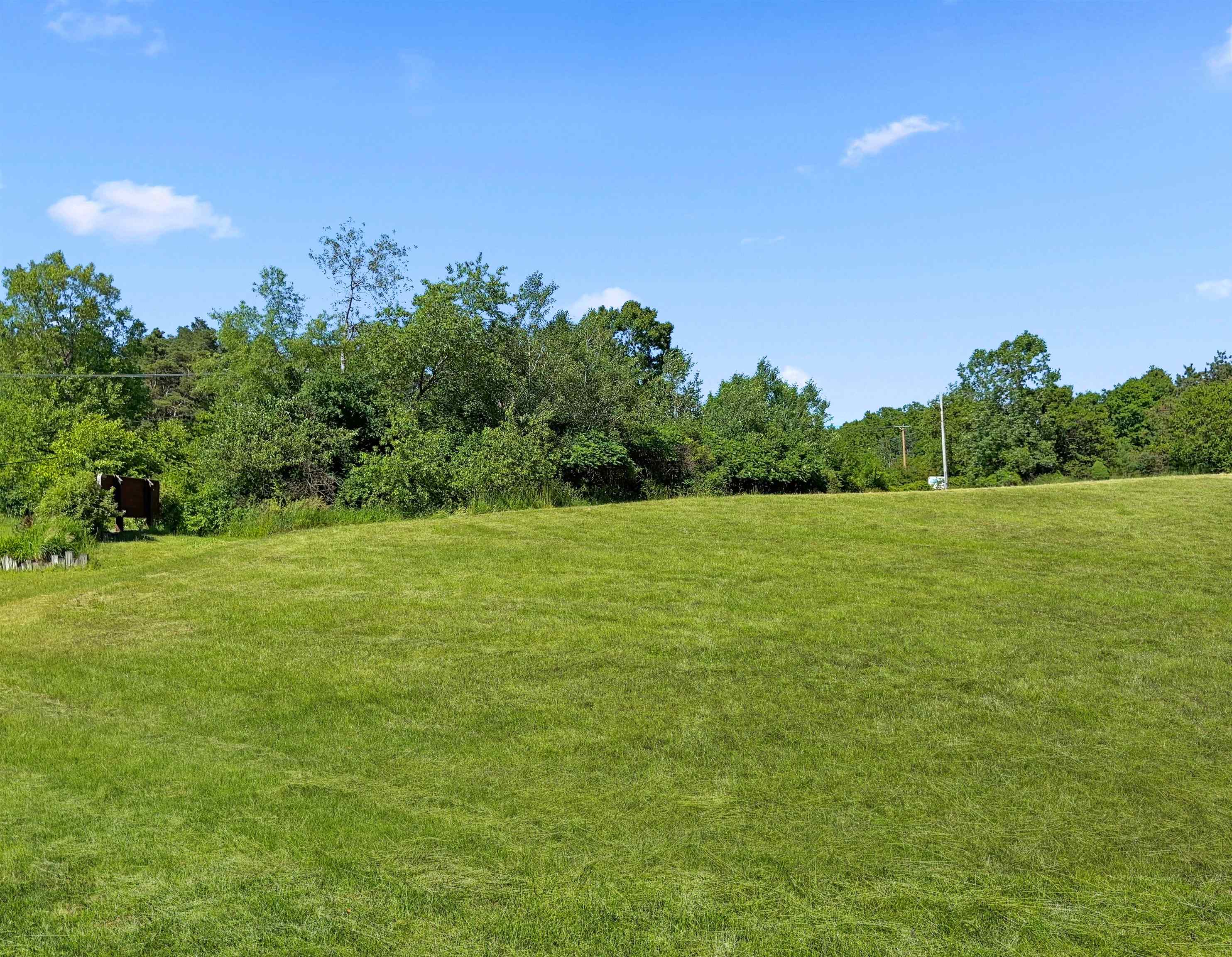 a view of a field with an ocean