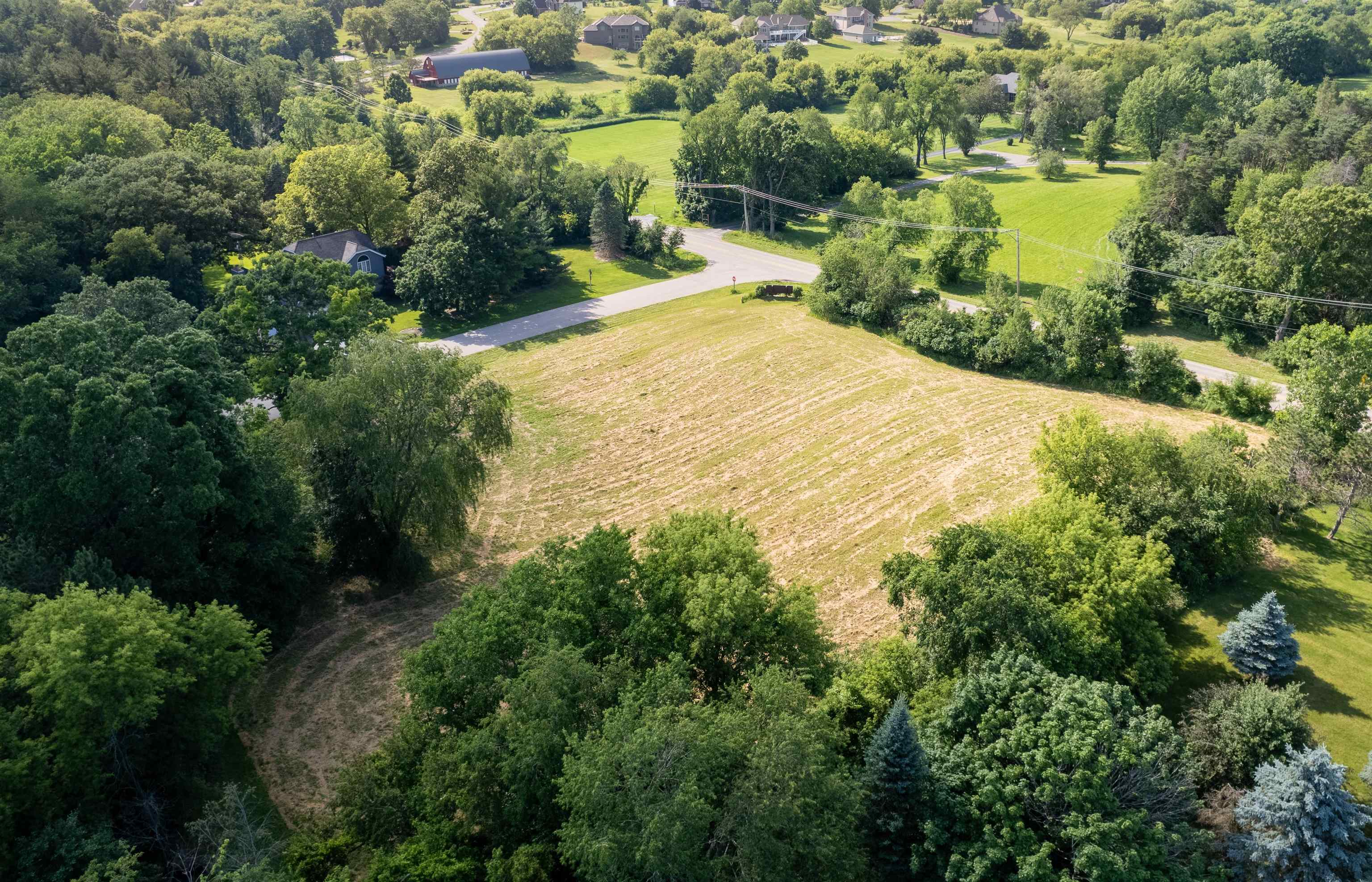 11999 Oakridge Road Caledonia, IL 61011 - Photo 11 of 17 an aerial view of residential houses with outdoor space and trees all around