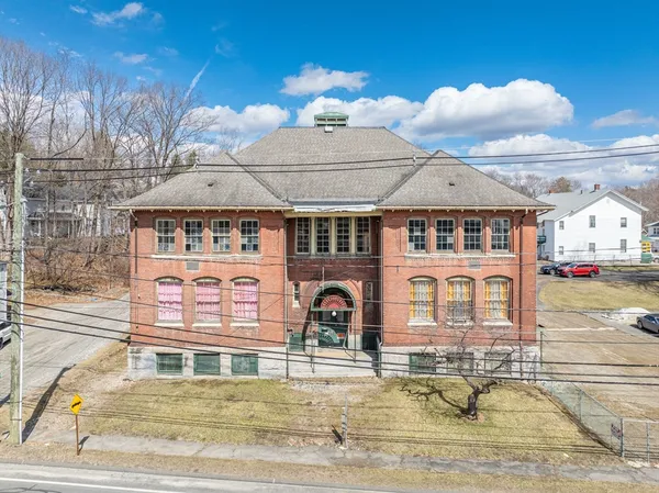 a front view of a house with swimming pool