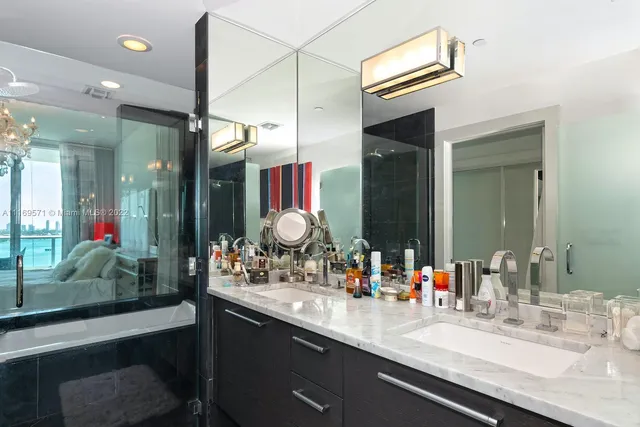 a bathroom with a double vanity sink and a mirror