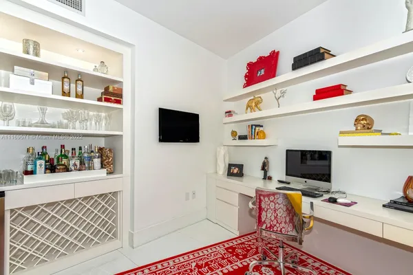 a blue and white bed sitting in a room