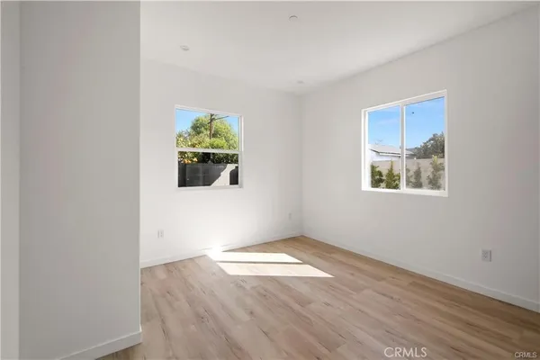 a view of empty room with windows