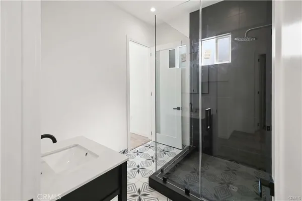 a bathroom with a toilet and a mirror