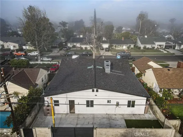 a view of a kitchen with a sink and a refrigerator