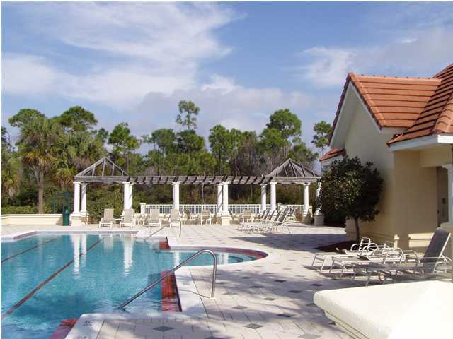 4595 Sailmaker Lane Destin, FL 32541 - Photo 12 of 14 a swimming pool with outdoor seating and yard in the back