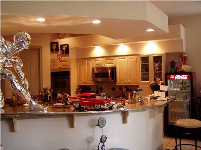 4595 Sailmaker Lane Destin, FL 32541 - Photo 3 of 14 a kitchen with a sink and cabinets