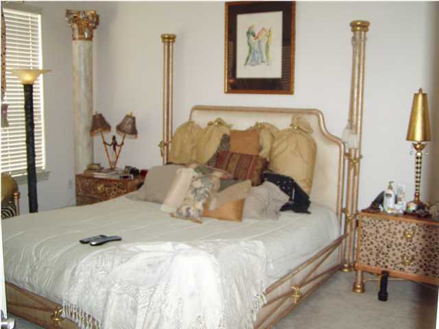 4595 Sailmaker Lane Destin, FL 32541 - Photo 4 of 14 a bedroom with a bed and a couch