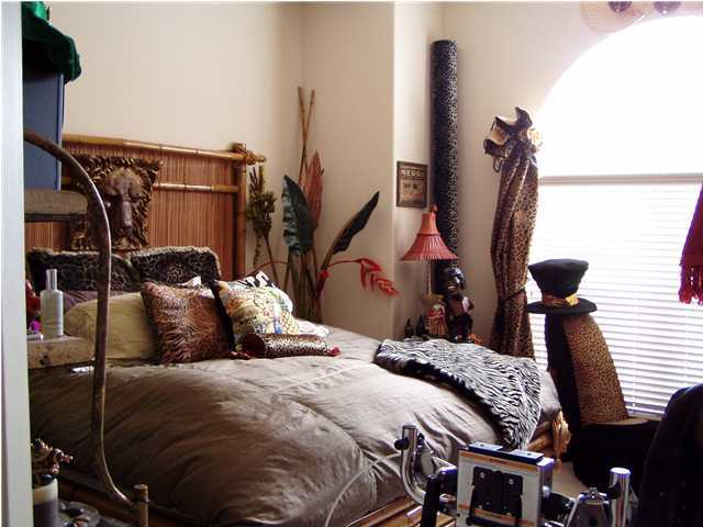 4595 Sailmaker Lane Destin, FL 32541 - Photo 7 of 14 a bedroom with a bed and wooden floor