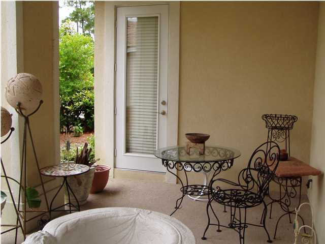 4595 Sailmaker Lane Destin, FL 32541 - Photo 8 of 14 a view of a balcony with table and chairs