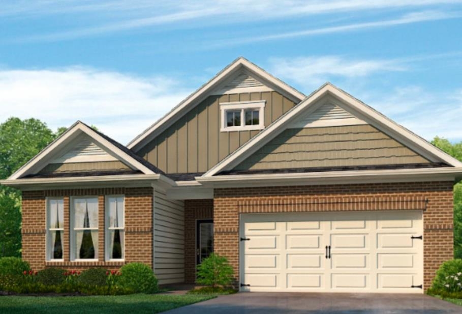 View of front of home featuring a garage