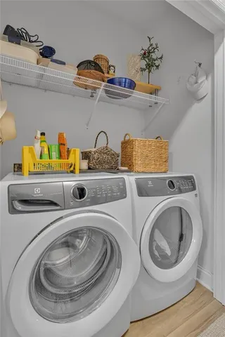a utility room with sink and washer dryer