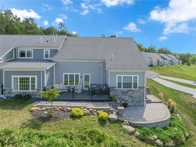 a aerial view of a house with swimming pool yard and outdoor seating