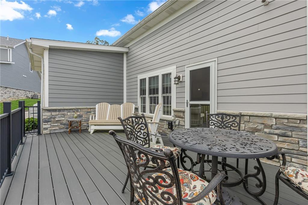 16 Pinehurst Place Beaver, PA 15009 - Photo 26 of 34 a roof deck with a dining table and chairs with wooden floor