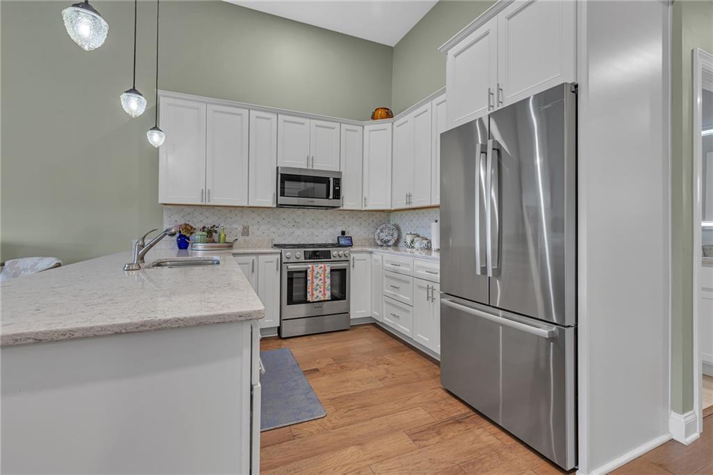 16 Pinehurst Place Beaver, PA 15009 - Photo 5 of 34 a kitchen with stainless steel appliances a refrigerator sink and microwave