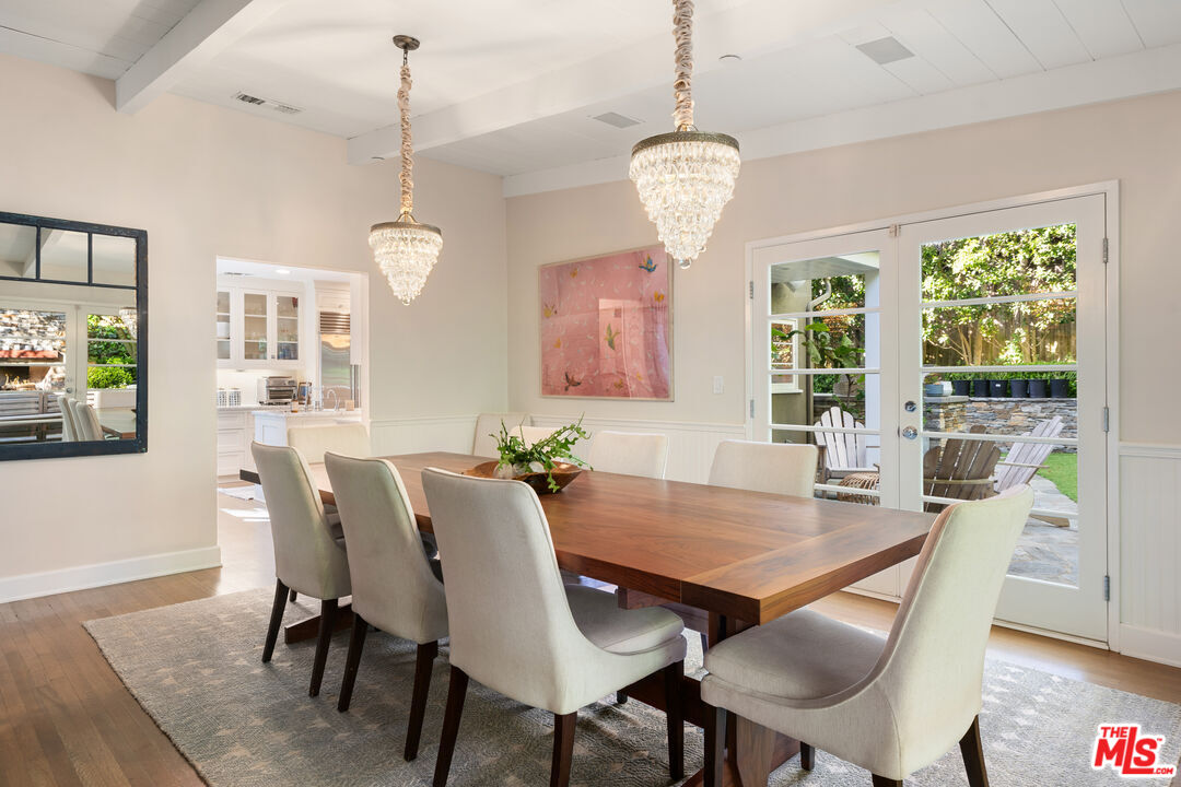 3354 Mandeville Canyon Road Los Angeles, CA 90049 - Photo 12 of 63 a view of a dining room with furniture window and wooden floor