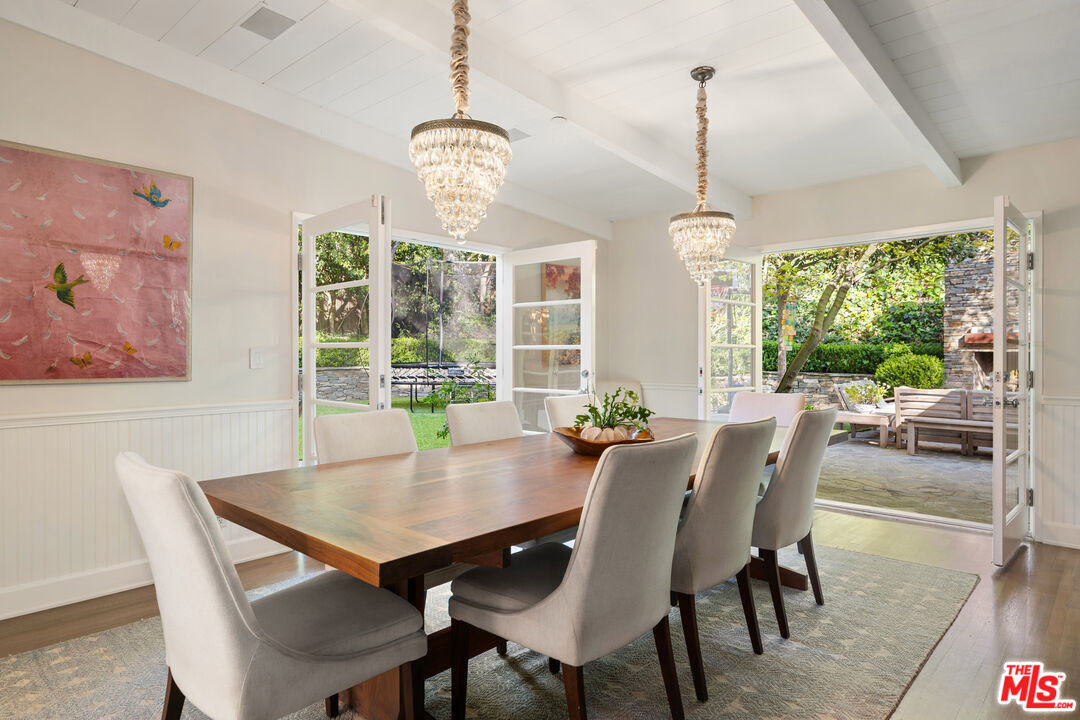 3354 Mandeville Canyon Road Los Angeles, CA 90049 - Photo 13 of 63 a view of a dining room with furniture window and outside view