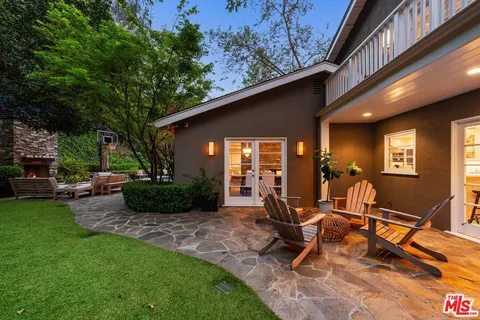 a view of a chairs and table in a patio