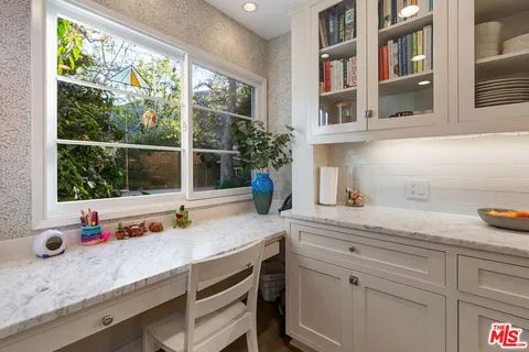 a bath tub sitting in a bathroom next to a window