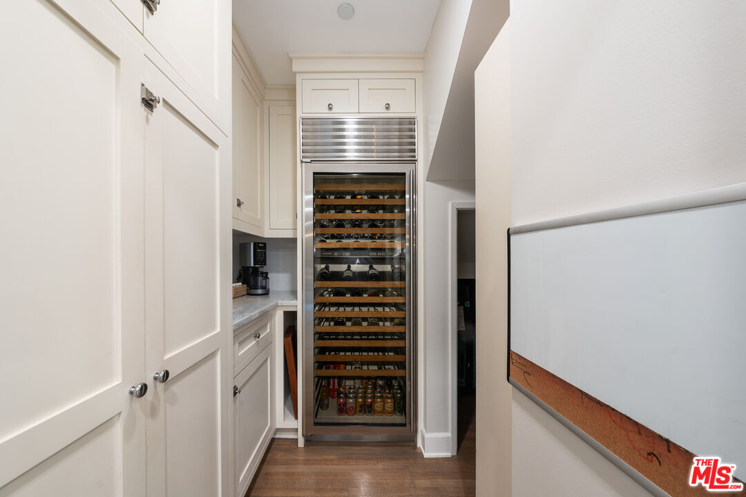 3354 Mandeville Canyon Road Los Angeles, CA 90049 - Photo 33 of 63 a view of walk in closet with empty racks