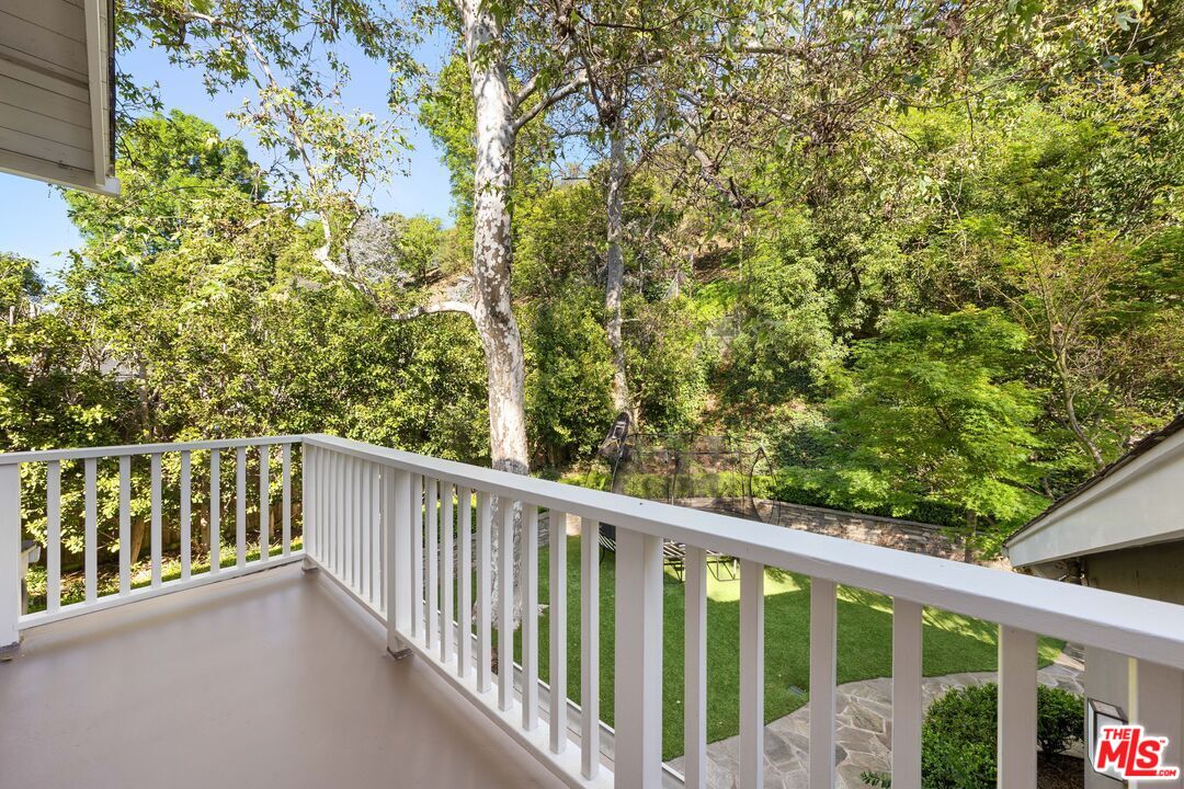 3354 Mandeville Canyon Road Los Angeles, CA 90049 - Photo 46 of 63 a view of a balcony with outdoor space