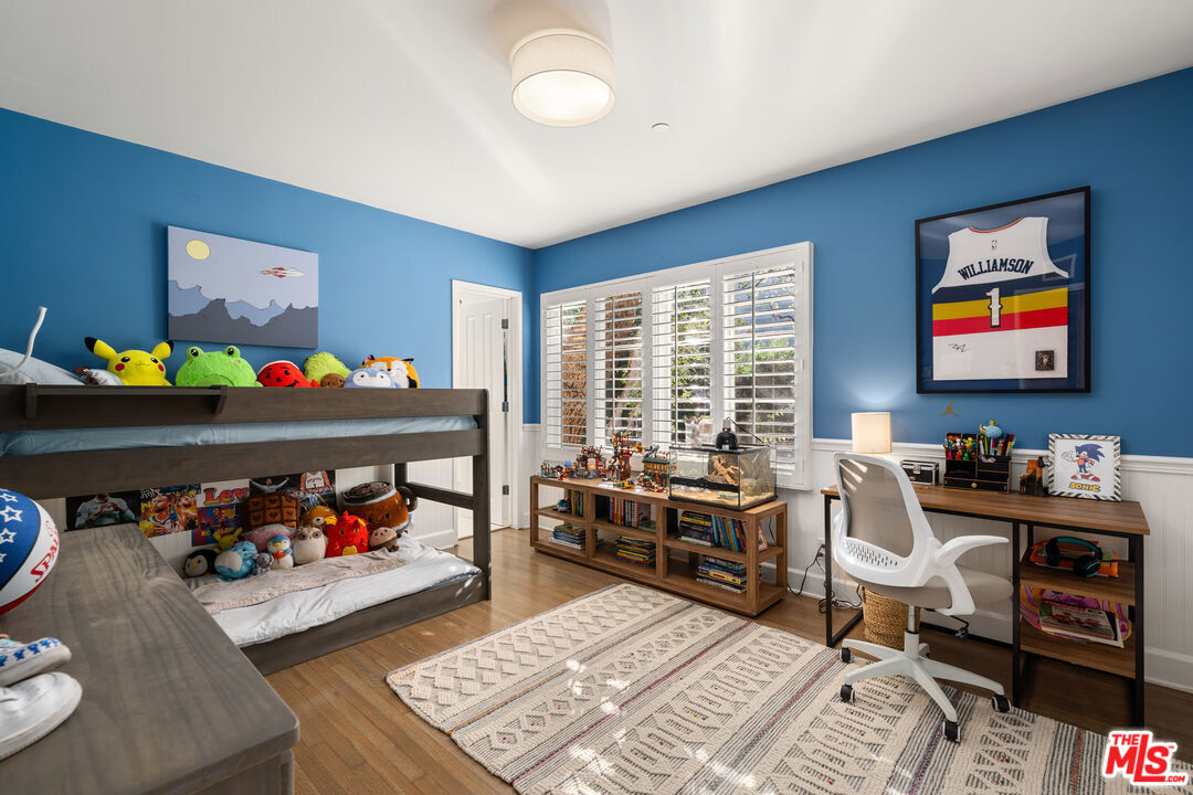 3354 Mandeville Canyon Road Los Angeles, CA 90049 - Photo 50 of 63 a bedroom with furniture toys and a large window