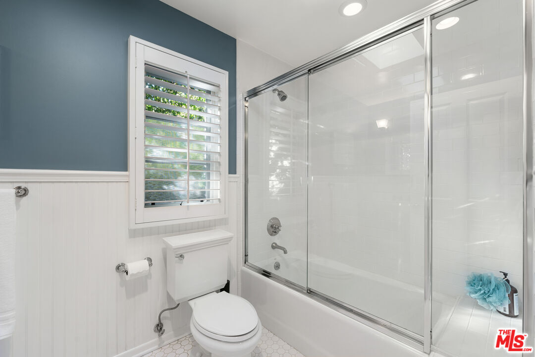 3354 Mandeville Canyon Road Los Angeles, CA 90049 - Photo 57 of 63 a bathroom with a shower a toilet and a shower