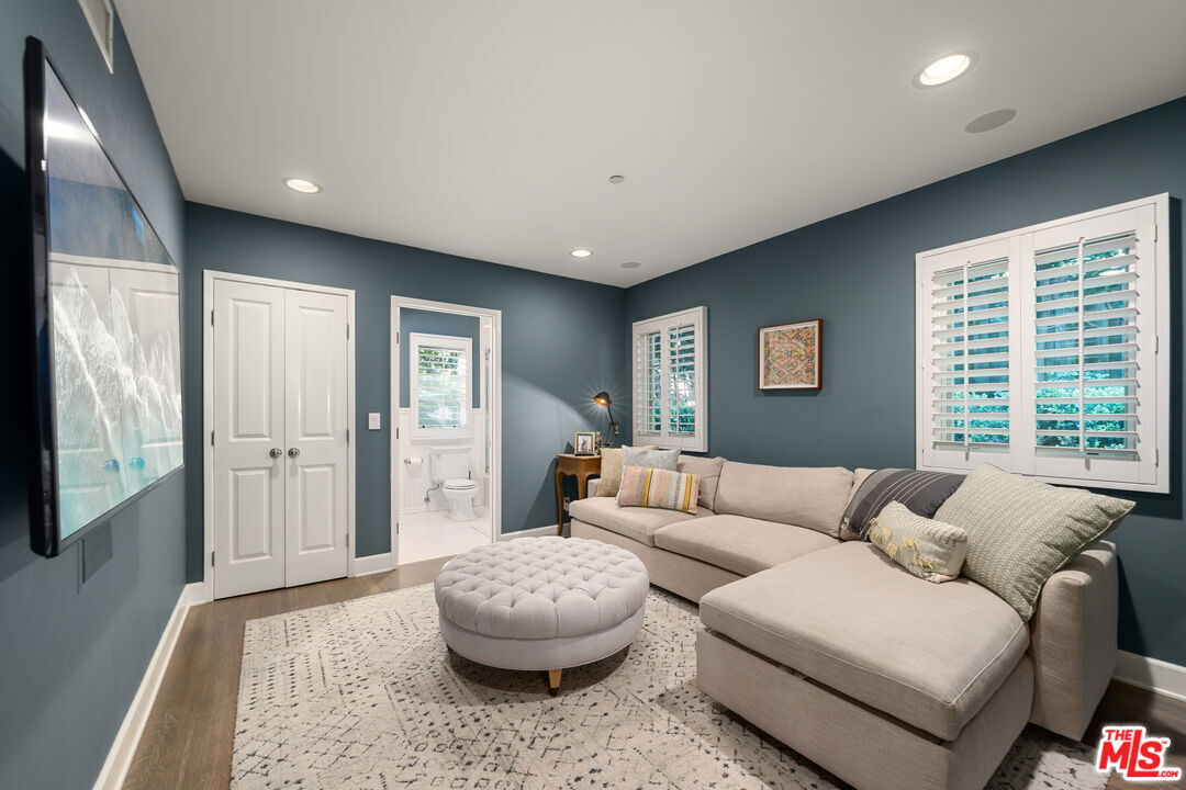 3354 Mandeville Canyon Road Los Angeles, CA 90049 - Photo 59 of 63 a living room with furniture and a large window