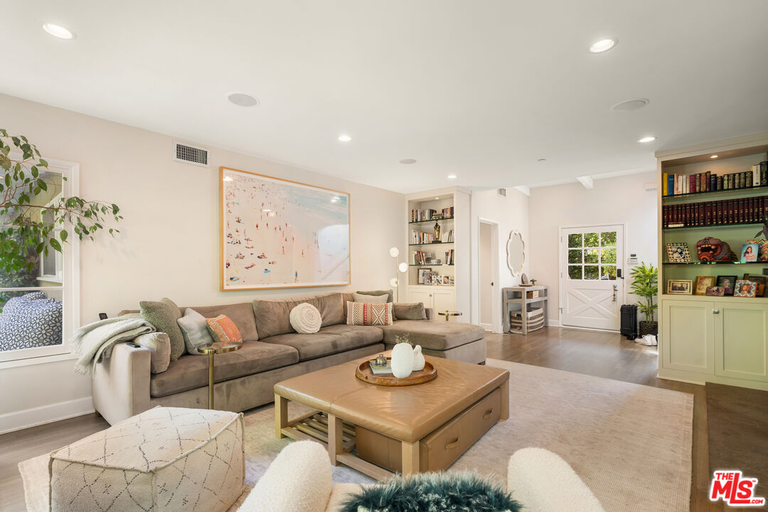 3354 Mandeville Canyon Road Los Angeles, CA 90049 - Photo 8 of 63 a living room with furniture and a table