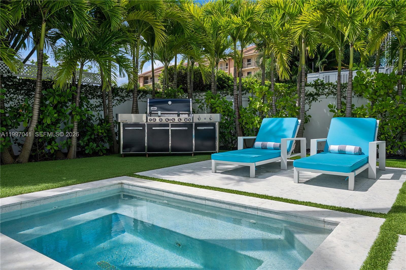 2628 Marcinski Road Jupiter, FL 33477 - Photo 11 of 50 a house view with a sitting space and garden