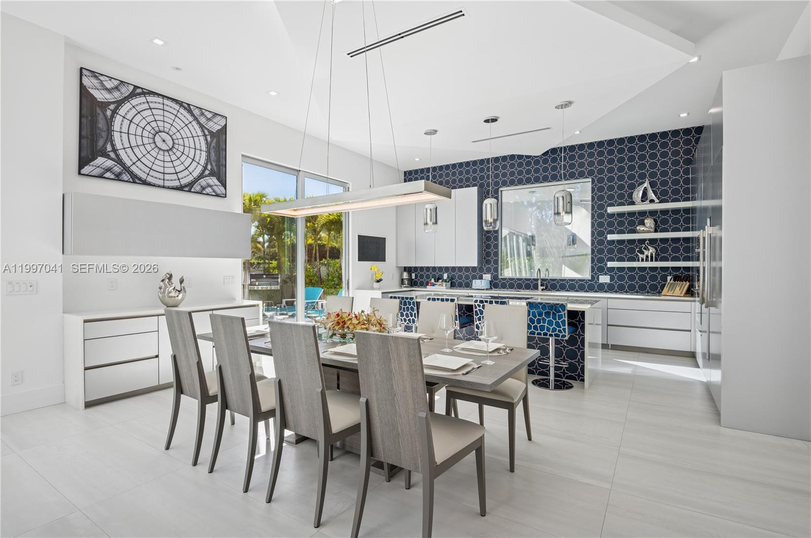 2628 Marcinski Road Jupiter, FL 33477 - Photo 18 of 50 a view of a dining room with furniture