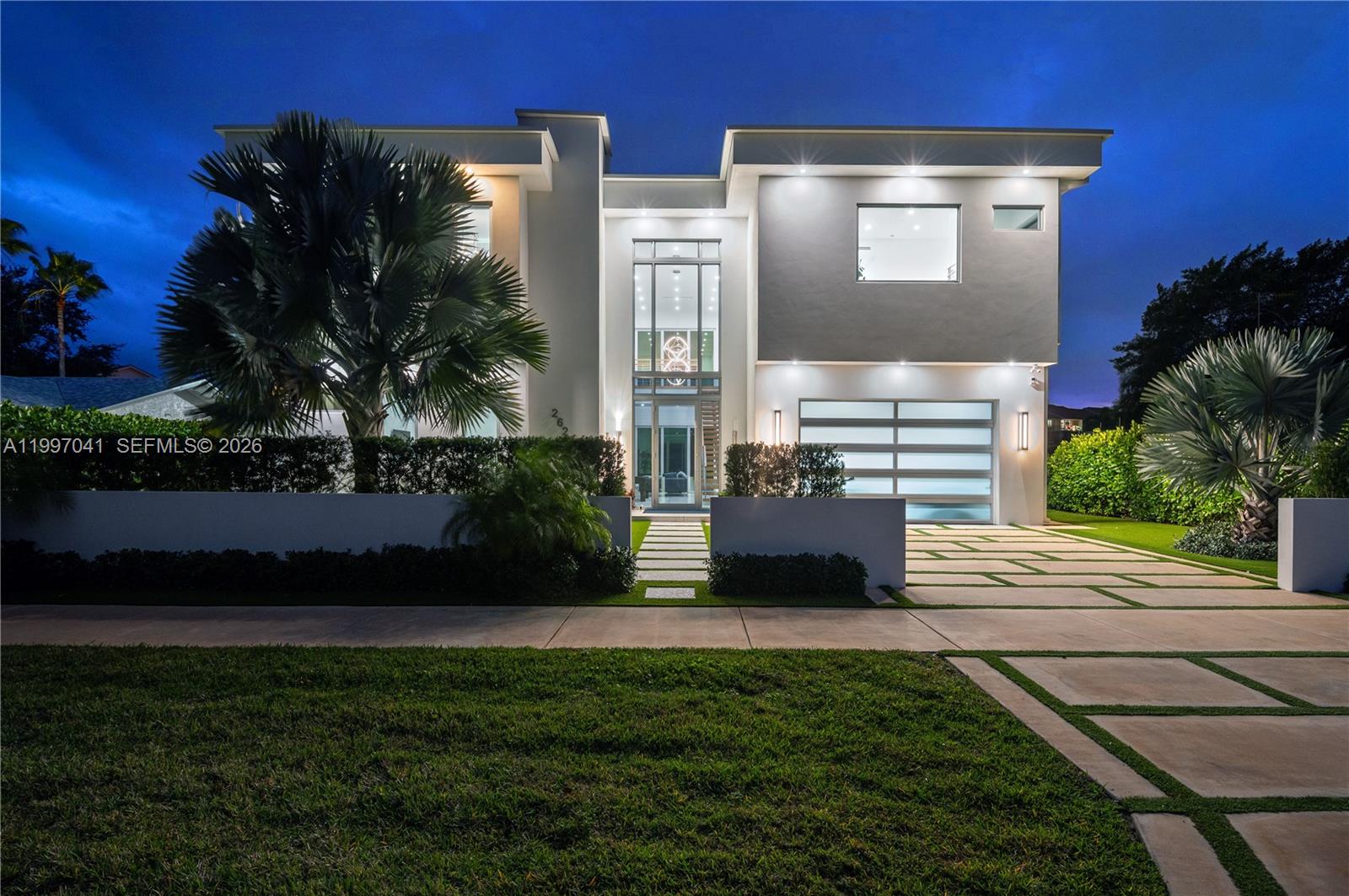 2628 Marcinski Road Jupiter, FL 33477 - Photo 2 of 50 a view of house with yard