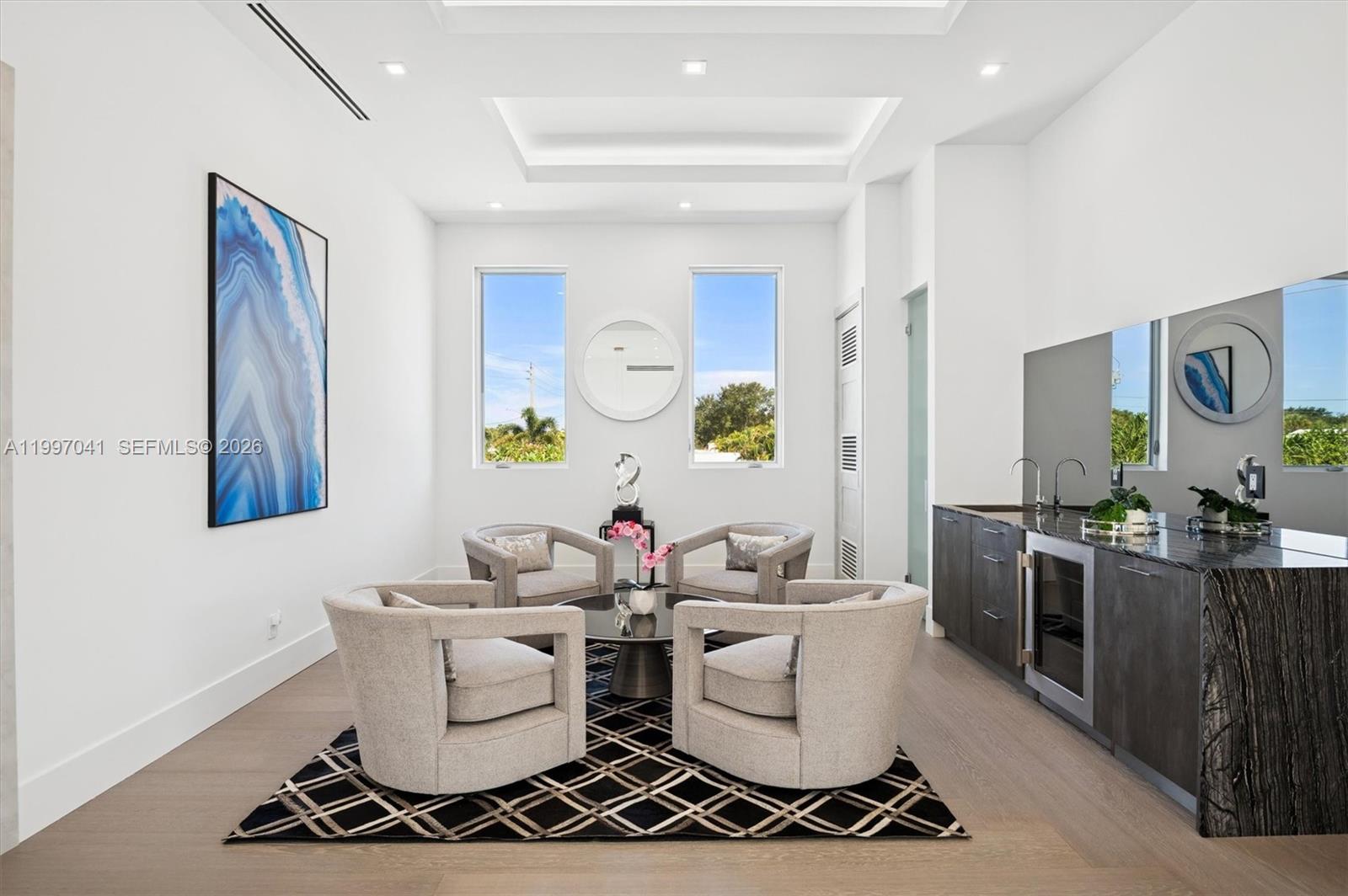 2628 Marcinski Road Jupiter, FL 33477 - Photo 23 of 50 a living room with furniture and painting on the wall