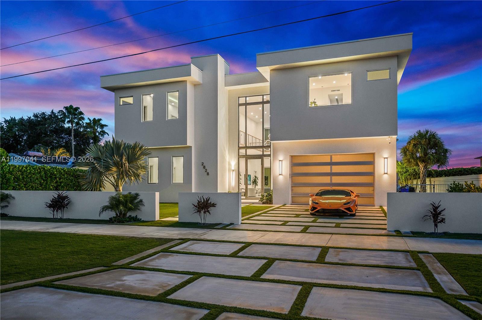 2628 Marcinski Road Jupiter, FL 33477 - Photo 3 of 50 a front view of a house with a yard