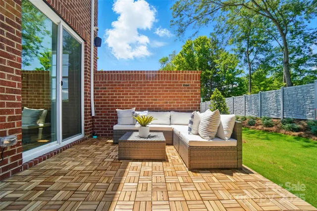 a view of a house with a yard and sitting area