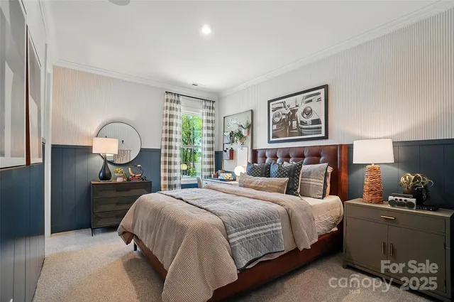 a bedroom with a bed and a lamp on table