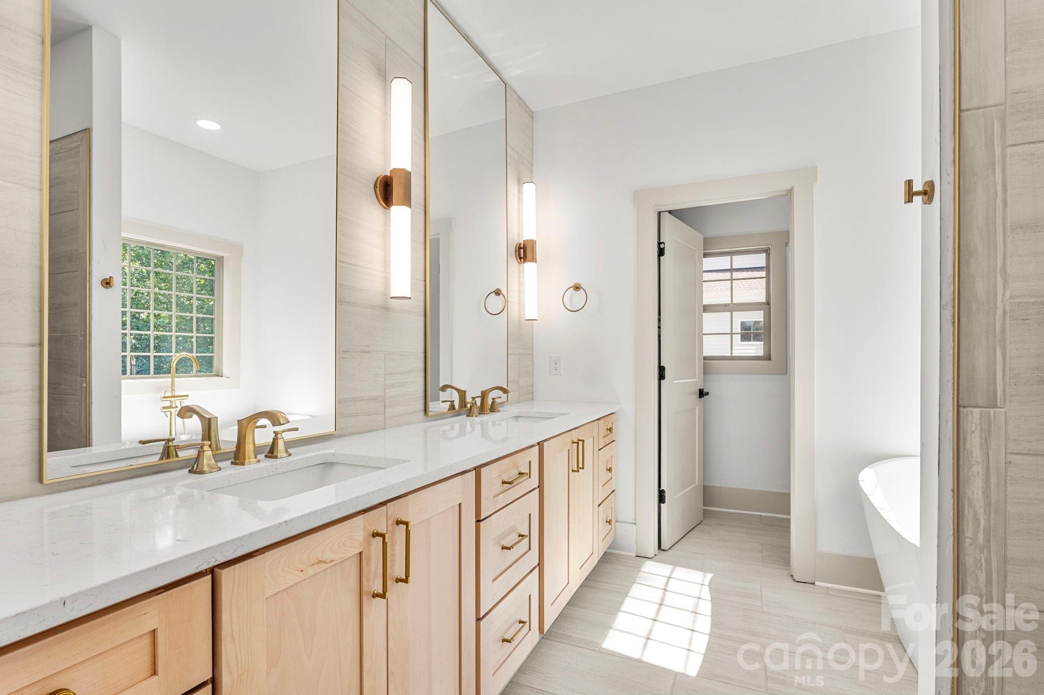 1167 Tirzah Road Rock Hill, SC 29732 - Photo 12 of 25 a spacious bathroom with double vanity and a mirror