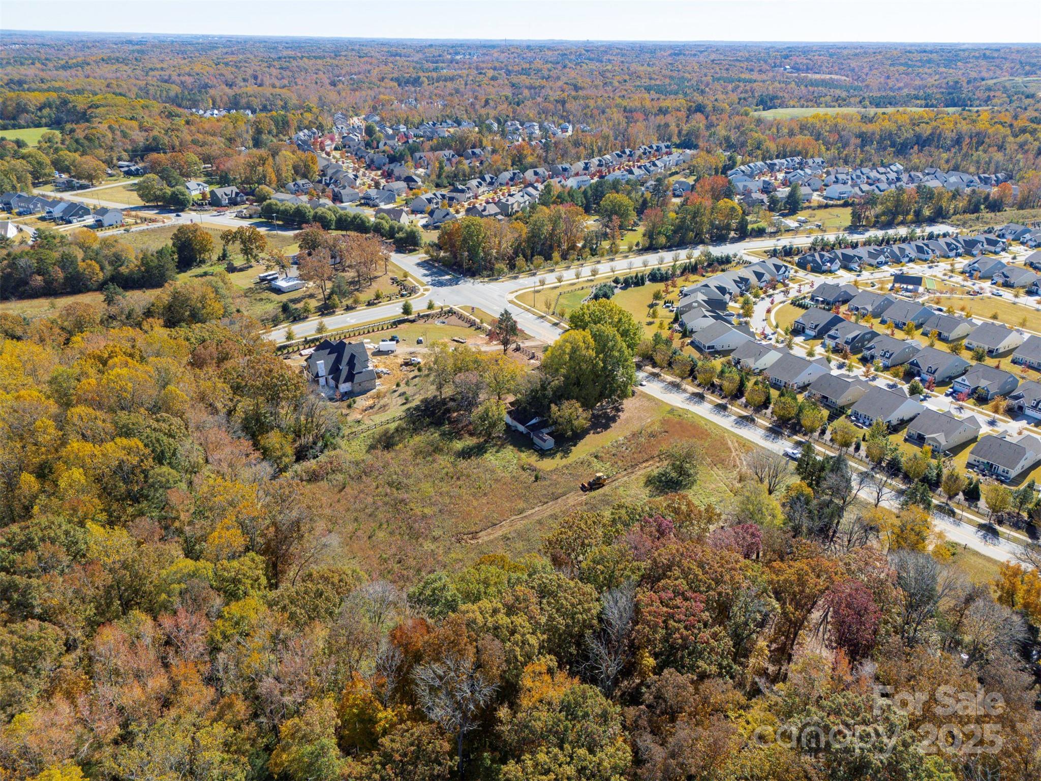 14 Huntersville-Concord Road, Unit COVINGTON Huntersville, NC 28078 - Photo 13 of 13 an aerial view of residential house with parking and trees