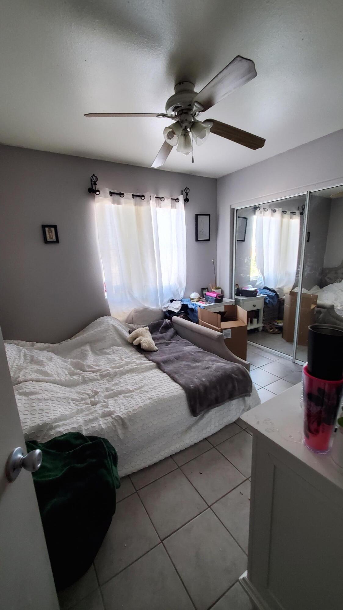 73965 Santa Rosa Way Palm Desert, CA 92260 - Photo 5 of 5 a bedroom with a bed couch and window