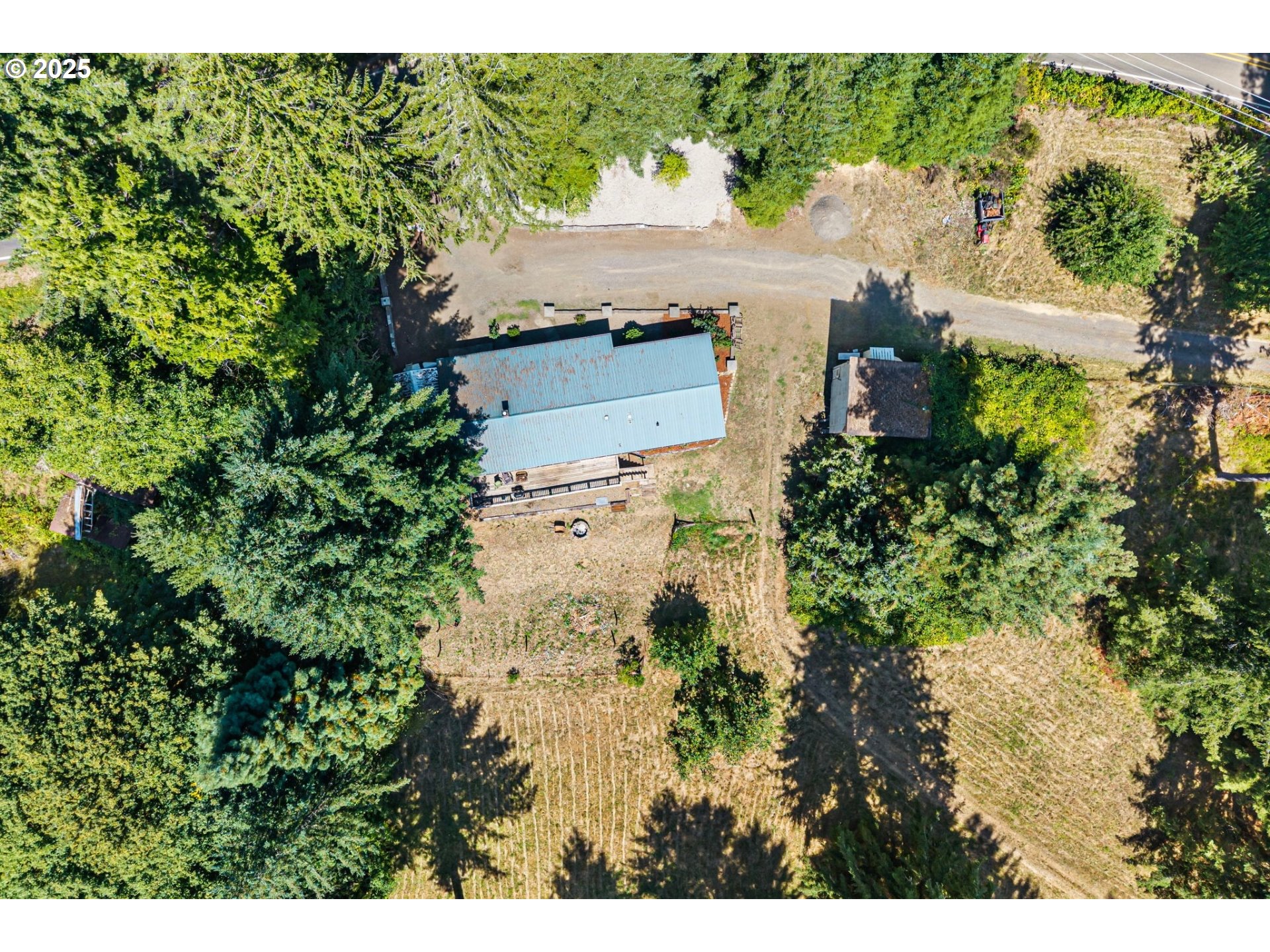89731 Indian Creek Road Swisshome, OR 97480 - Photo 20 of 46 an aerial view of a house with a yard