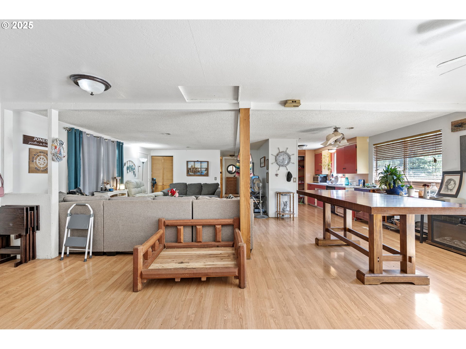 89731 Indian Creek Road Swisshome, OR 97480 - Photo 24 of 46 a living room with furniture and a wooden floor