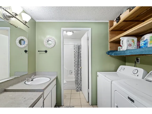 a bed room with a bed window and dresser