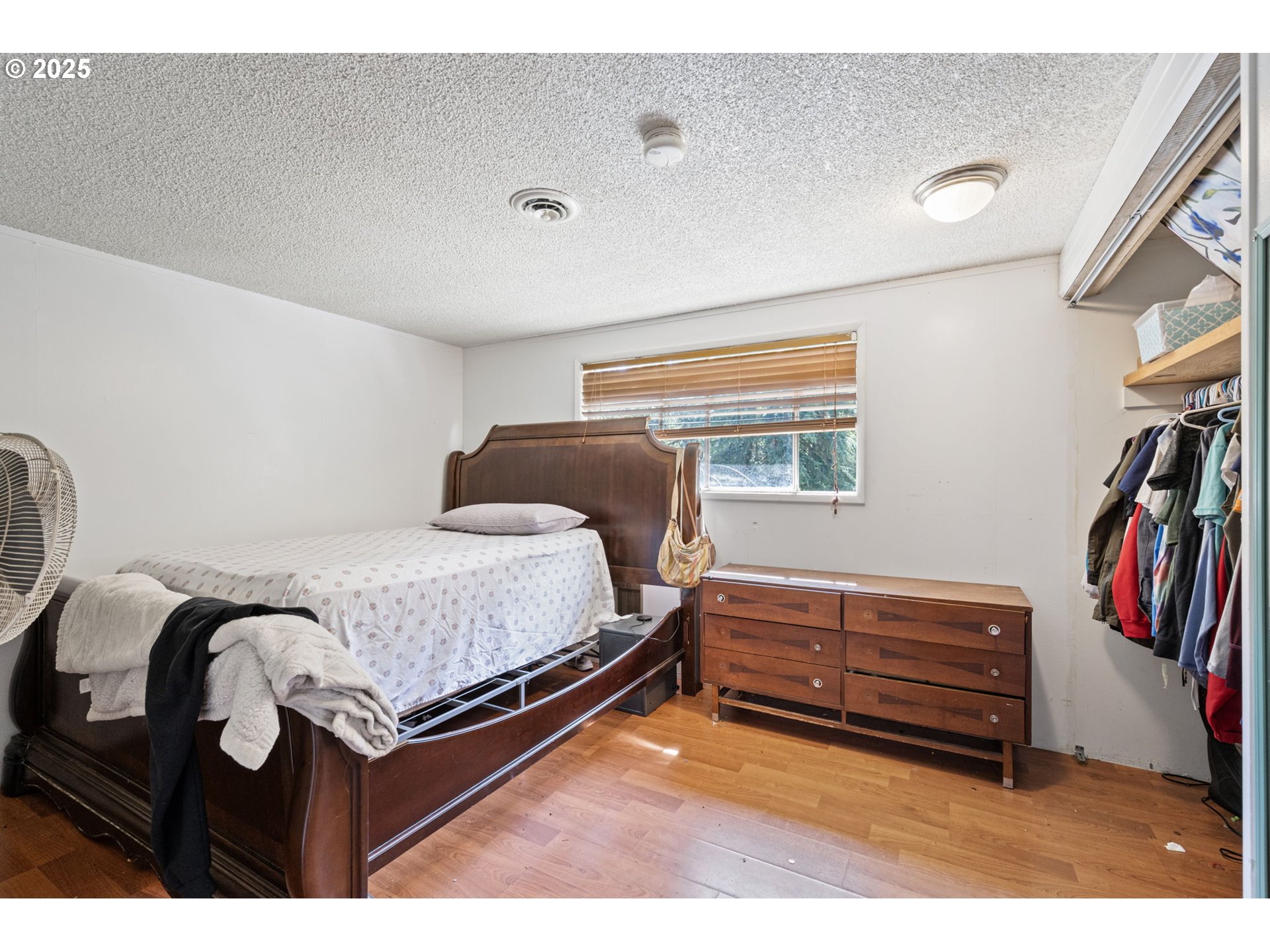 89731 Indian Creek Road Swisshome, OR 97480 - Photo 28 of 46 a bedroom with furniture and a closet