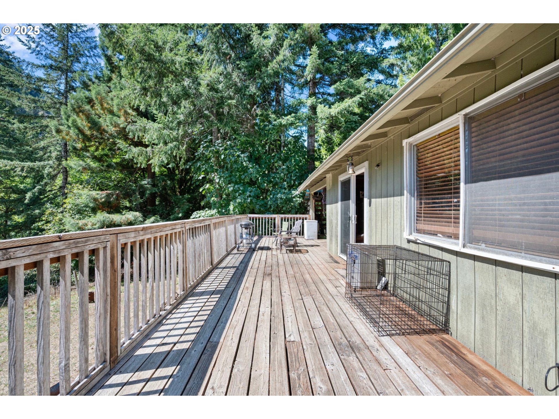 89731 Indian Creek Road Swisshome, OR 97480 - Photo 30 of 46 a view of balcony with wooden floor and fence