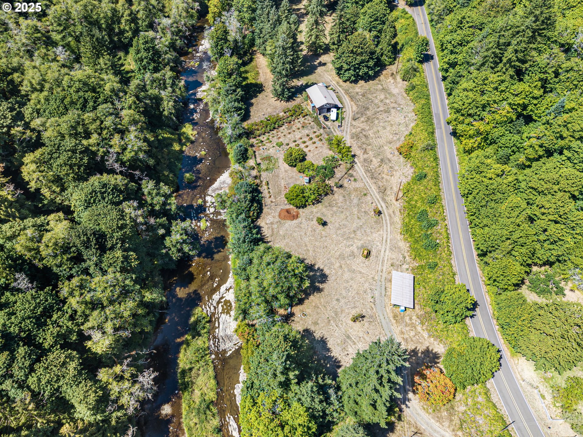 89731 Indian Creek Road Swisshome, OR 97480 - Photo 43 of 46 an aerial view of a residential houses with yard