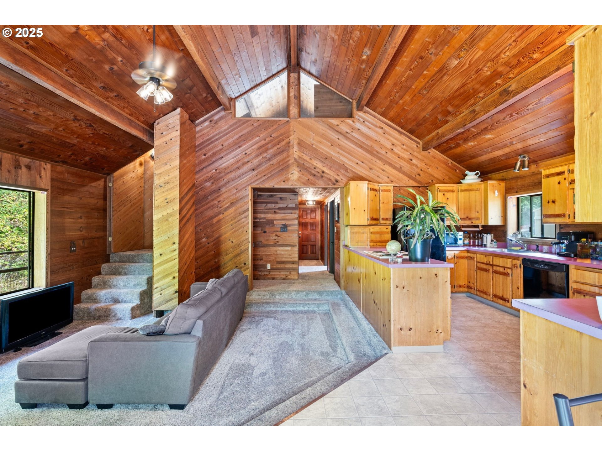 89731 Indian Creek Road Swisshome, OR 97480 - Photo 8 of 46 a view of a patio with couches and potted plants