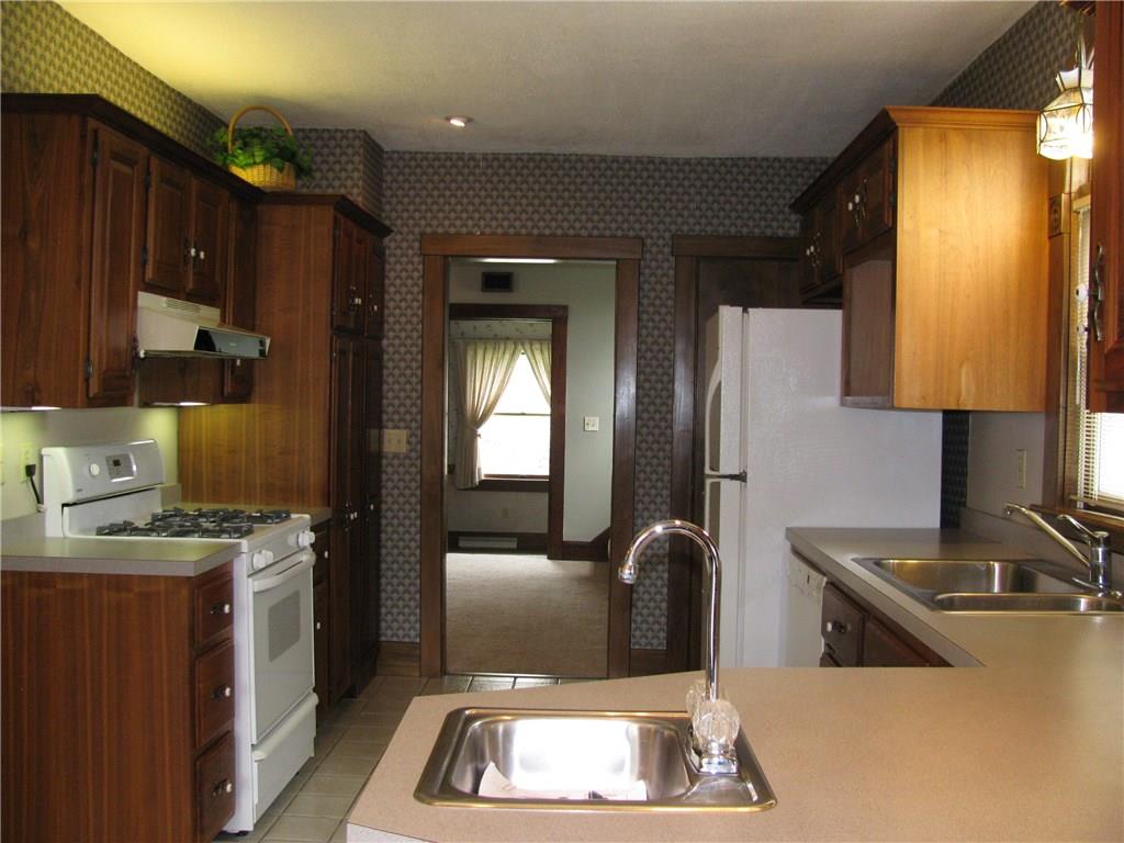 783 Mercer Road Greenville, PA 16125 - Photo 8 of 25 Newer walnut kitchen with appliance package, second prep sink, tile floors, pantry and recess lighting.