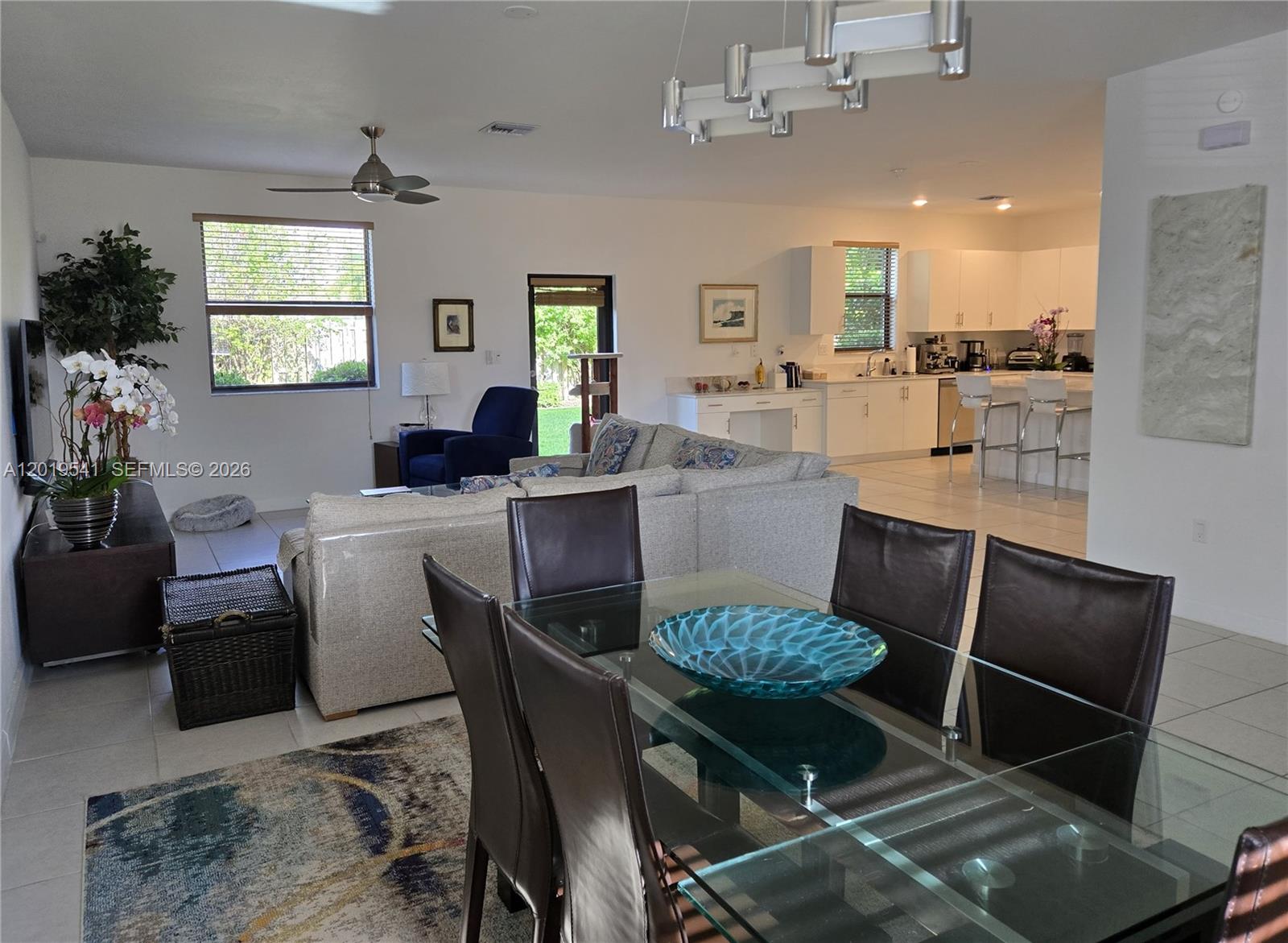 24400 Southwest 119th Place Homestead, FL 33032 - Photo 20 of 22 a kitchen with granite countertop kitchen island dining table and chairs